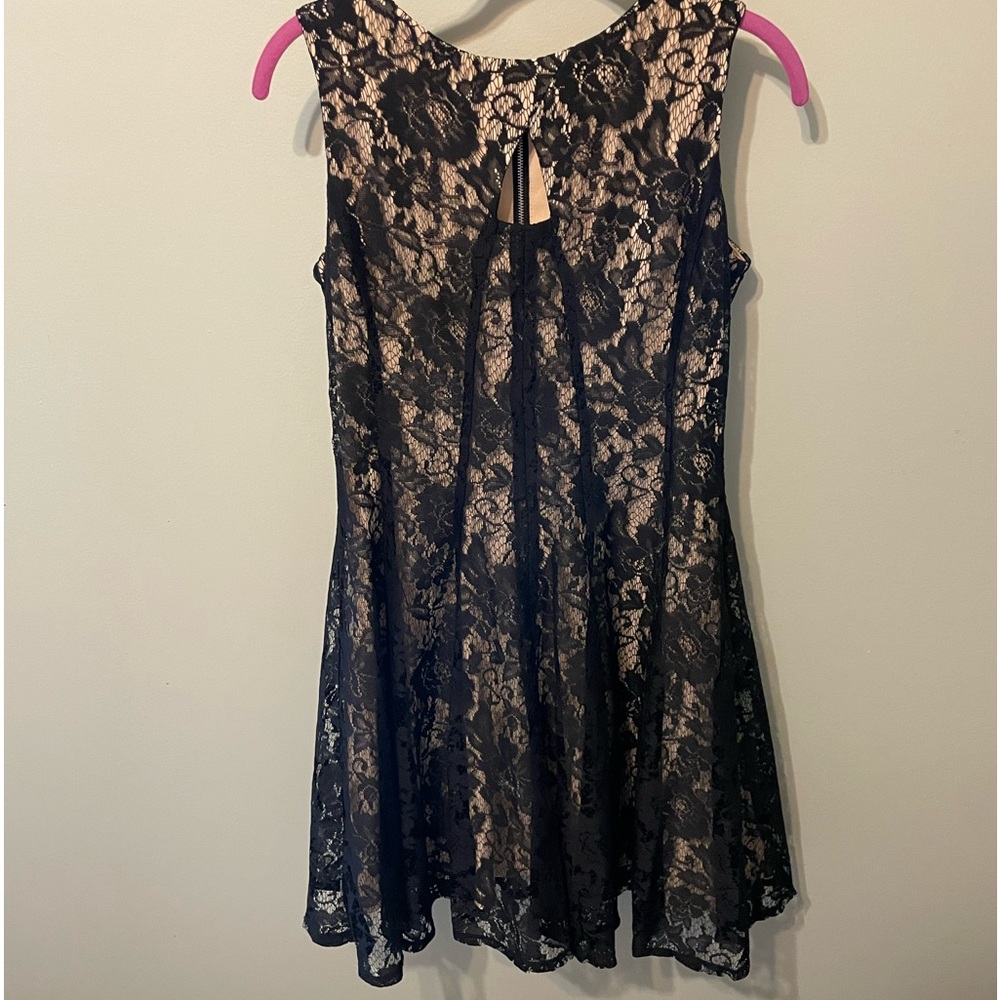 Danny and Nicole nude dress with black lace. Peep hole neck